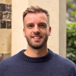 Aidan Fisher-Rowe, Associate Director of Transport & Highways at Create Consulting Engineers, smiling at camera outdoors.