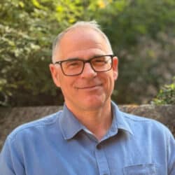 Peter Lavers, Health and Safety Manager at Create Consulting Engineers, wearing glasses and blue shirt outdoors.