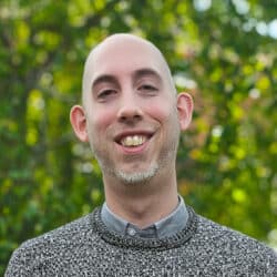 Alastair Worsley, Senior BIM / CAD Technician at Create Consulting Engineers, smiling outdoors against green foliage background.
