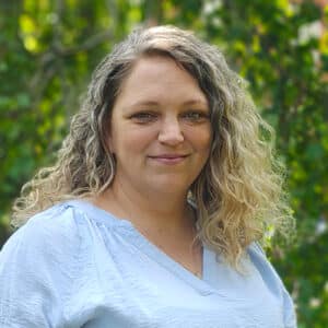 Tracey Tooke, consulting engineer at Create Consulting Engineers, pictured outdoors against green foliage background.