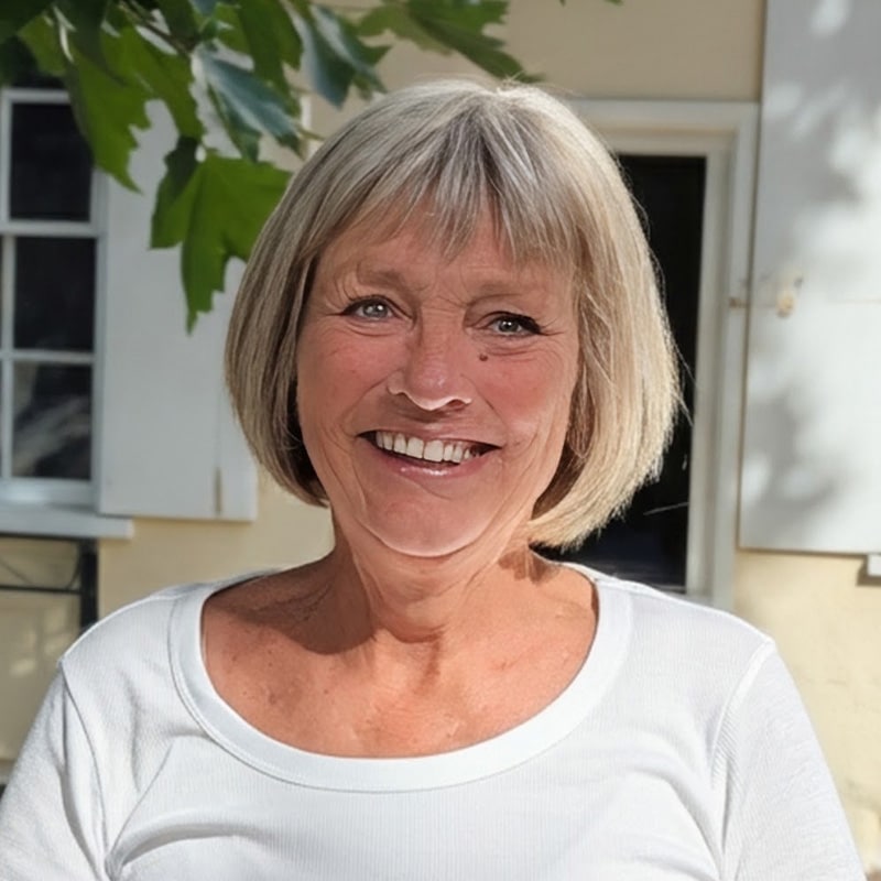Angie Fisher, consultant at Create Consulting Engineers, smiling outdoors in casual white top
