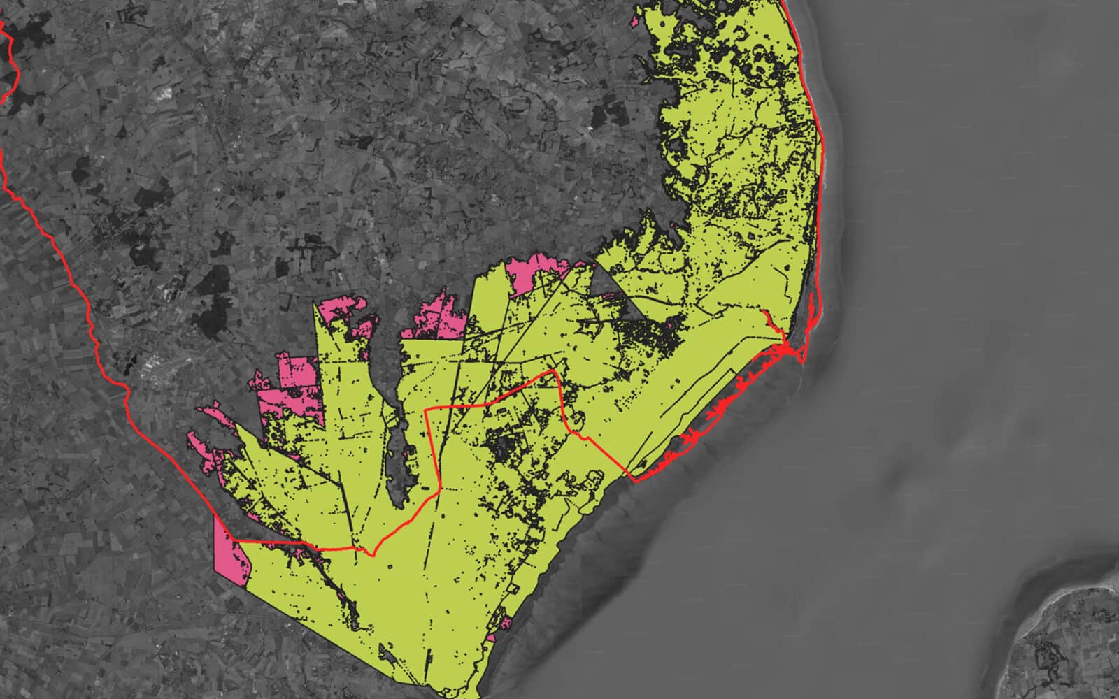 A greyscale map with yellow and pink shaded areas bordered by a red line, depicting land divisions along a coastal region as part of the East Lindsey Strategic Flood Risk Assessment.