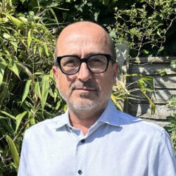 Rob Brusselen, consultant at Create Consulting Engineers, wearing glasses and light blue shirt outdoors.