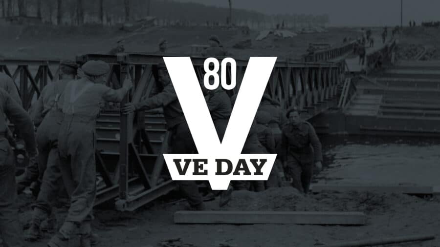 Soldiers build a bridge over water with "80 VE DAY" text overlay, commemorating the 80th anniversary of Victory in Europe Day during World War II.