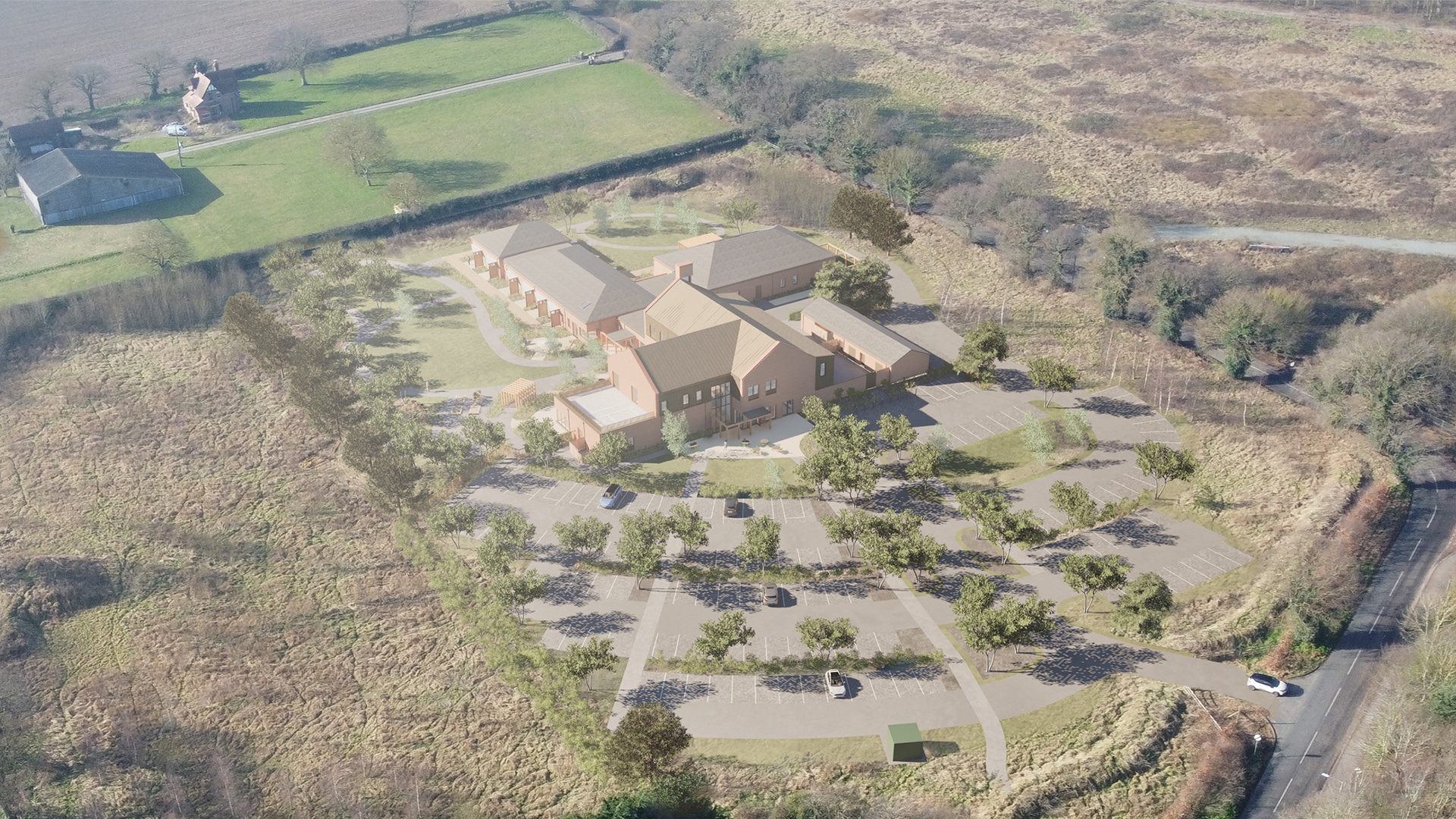 Aerial view of a large building complex with a circular driveway and parking area, surrounded by open fields and some trees, with roads nearby—an impressive site that could benefit from expertise like Create Consulting Engineers.