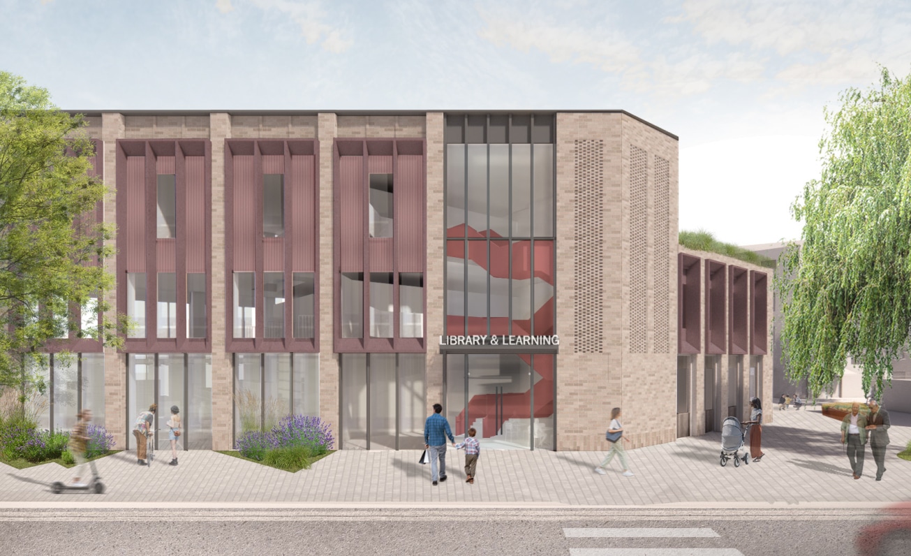 A modern, two-story library and learning center with large windows and a red staircase visible inside; people are walking on the sidewalk in front.