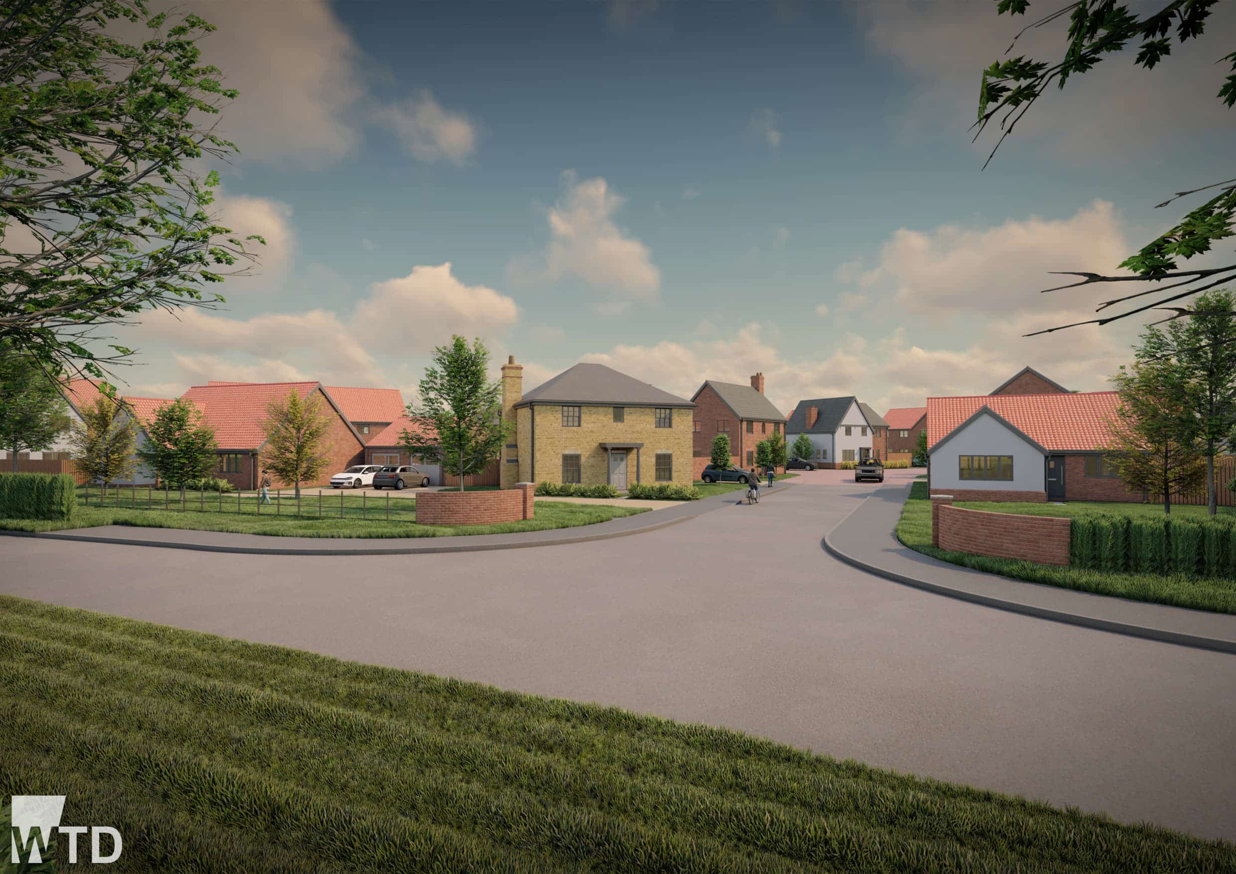 A suburban residential street in Buxton with modern detached houses, green lawns, and trees under a partly cloudy sky. The WTD logo appears in the bottom left corner.