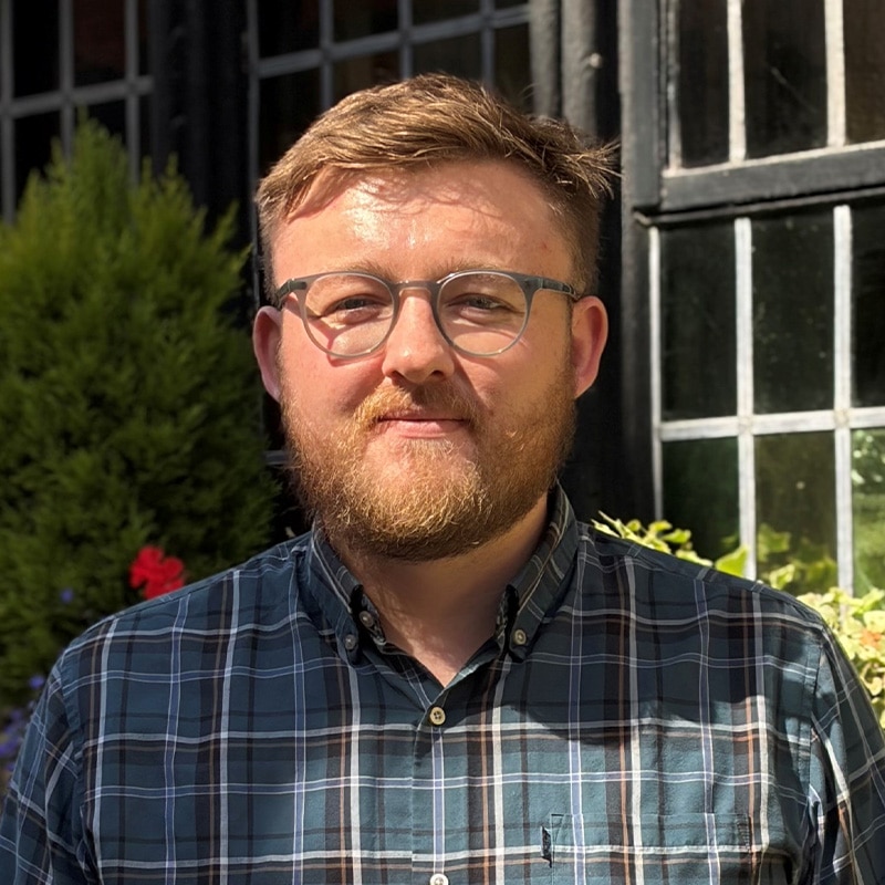 James White, Principal Civil Engineer at Create Consulting Engineers, wearing glasses and checked shirt outdoors.