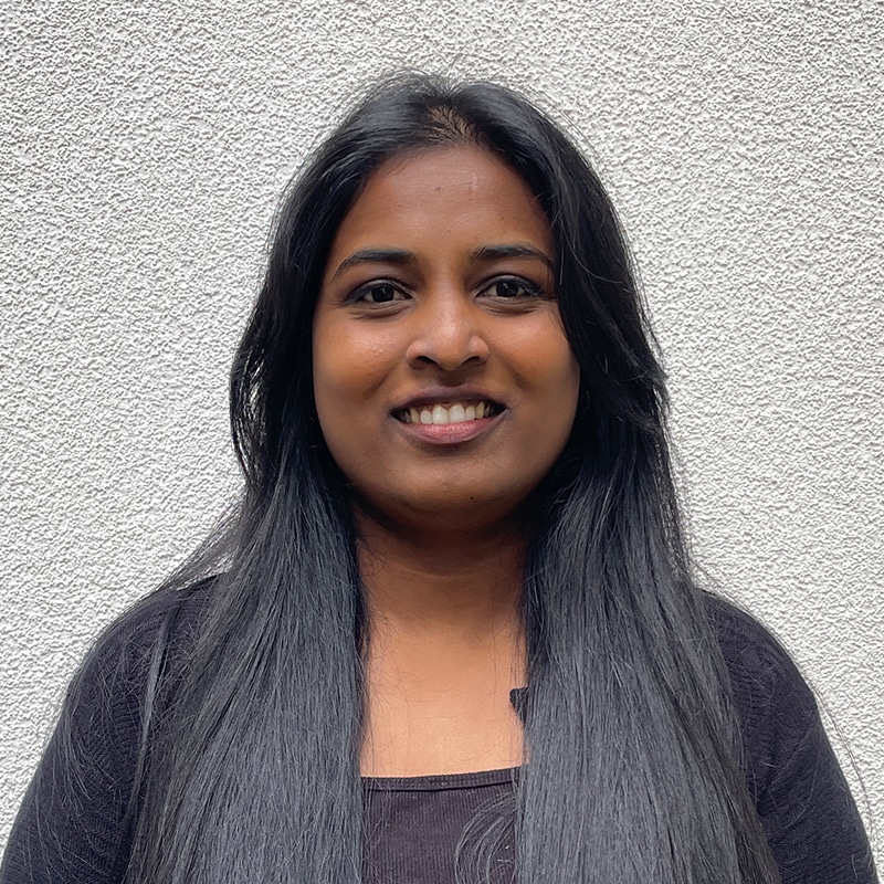Rethu Rathinam, engineering consultant at Create Consulting Engineers, smiling at camera against neutral background.