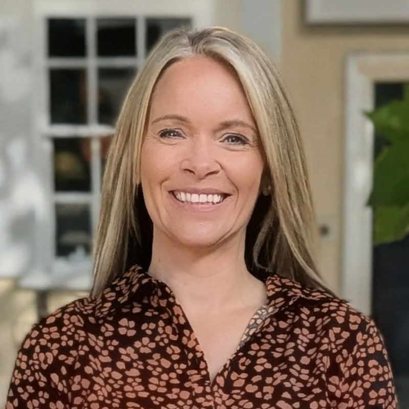 Amber Jefferson, consultant at Create Consulting Engineers, smiling at camera in office setting.